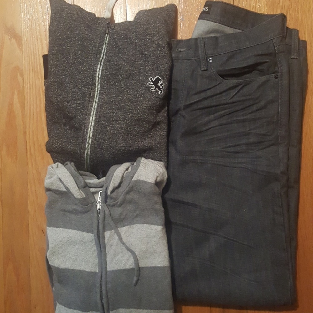 2 sweaters and pair of jeans